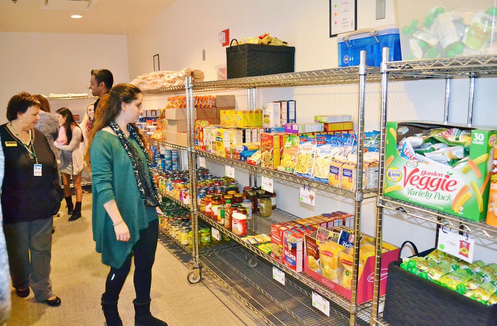 Volunteers handing out fresh produce at a food pantry